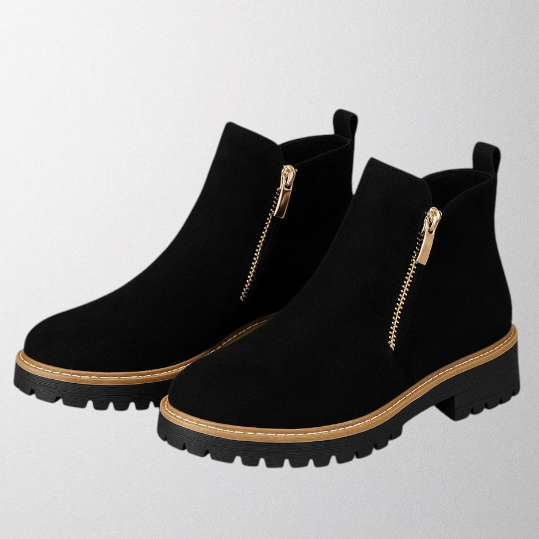Women's shoe with round toe and side zip fastening
