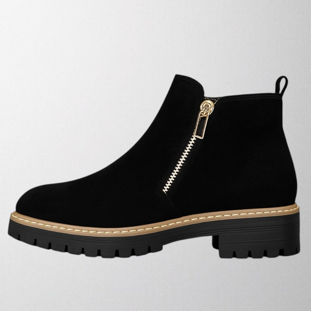 Women's shoe with round toe and side zip fastening