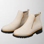 Women's shoe with round toe and side zip fastening