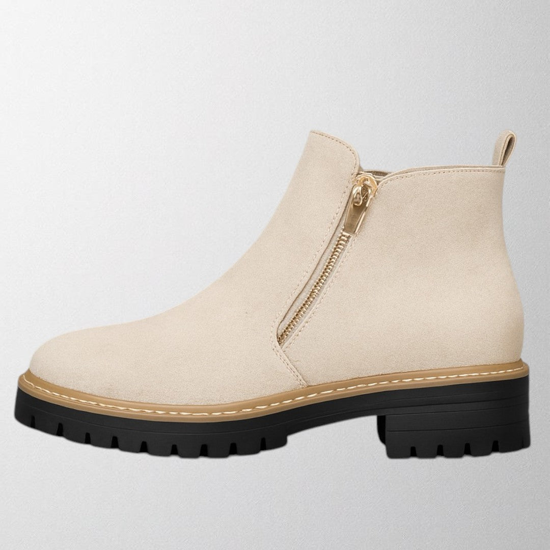 Women's shoe with round toe and side zip fastening