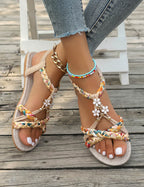 Women's Braided Flat Sandals with Floral Charm Details
