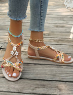 Women's Braided Flat Sandals with Floral Charm Details