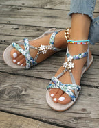 Women's Braided Flat Sandals with Floral Charm Details