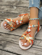 Women's Braided Flat Sandals with Floral Charm Details